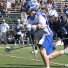 A Cabrini player moves downfield vs. a Wesley defender