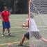 Greg Cattrano drills a young goalie on the art of stepping to the ball during a drill Friday in his clinic at Shipley School