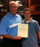 ManUp player Greg Merrill (Great Valley) presents letter of appreciation after his team donated a $1,000 to the Michael Breschi Scholarship