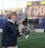 Haverford High and West Chester grad Cindy Timchal is presented with a special pair of running shoes by her Navy players after her 400th win last year