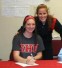 Caitlin Delaney (left) signing with her coach Katie Boyle (standing)