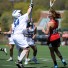 Harriton's Jane Henderson scores one of her three goals in Saturday's 15-13 win over Great Valley. Playing goal is Merrilee Viguers (Photo by Tim Flatley)