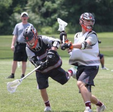Defenseman Matt Schwartz (right) of Phillie Elite and Archbishop Wood, makes a big hit during Friday's Adrenaline Black Card Showcase